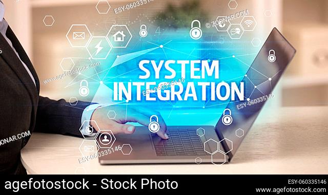 SYSTEM INTEGRATION inscription on laptop, internet security and data protection concept, blockchain and cybersecurity