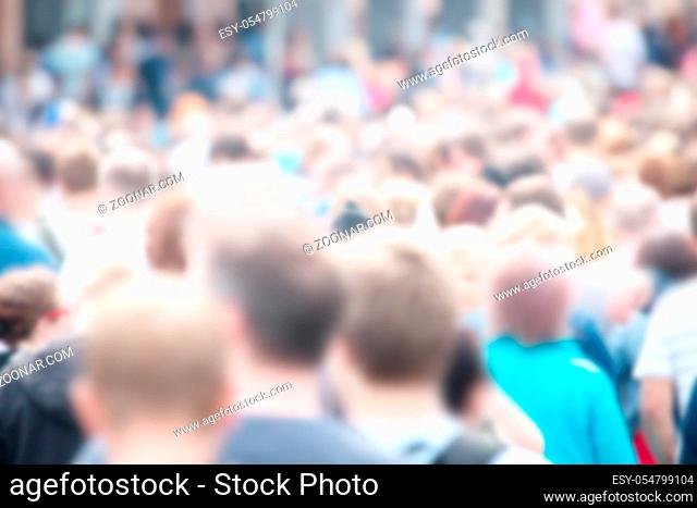 strong blurred, crowds of anonymous people on a city holiday in metropolis