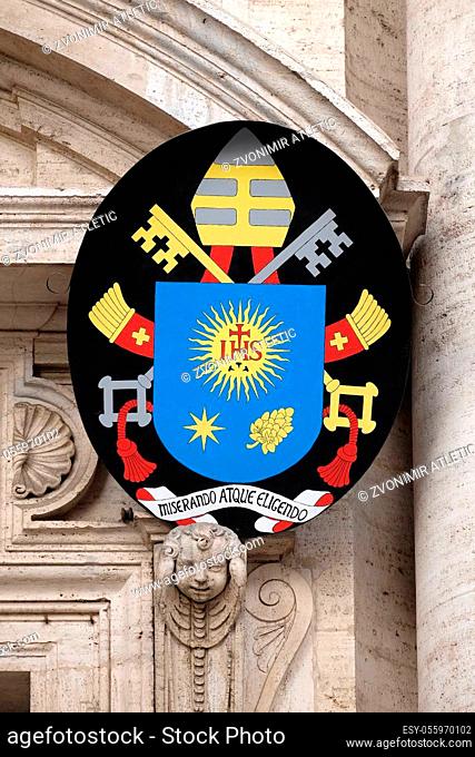 Coat of arms of Pope Francis, facade of the Church of the Gesu, mother church of the Society of Jesus, Rome, Italy