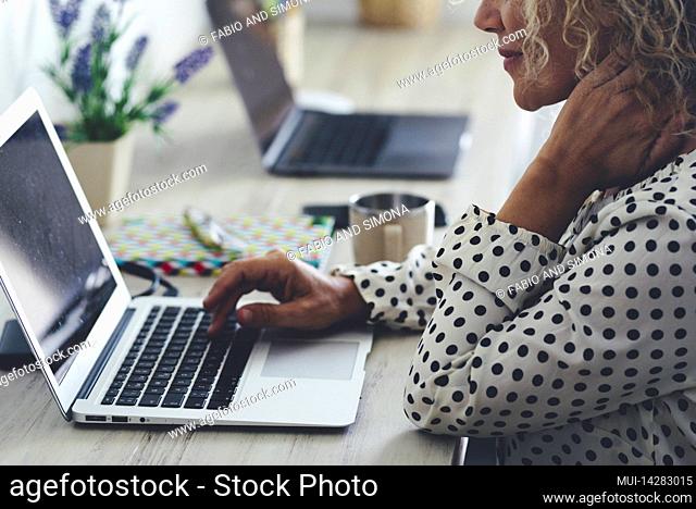 Close up of woman with laptop on desk in home office workspace