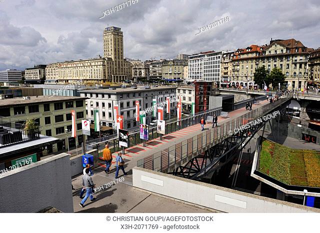 pedestrian bridge Passerelle du Flon crossing Place de l'Europe with the Bel-Air tower in background in Le Flon district, Lausanne, Canton of Vaud, Switzerland