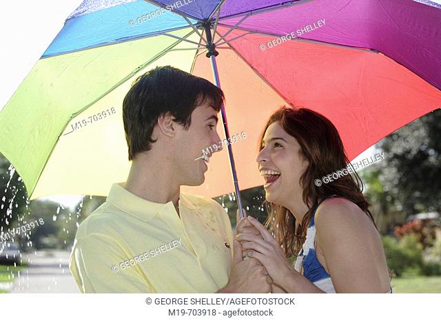 Couple under an umbrella in the rain