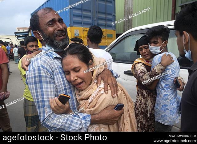 People are seen crying after family members died and got injured in a deadly fire that broke out at a food factory in Narayanganj's Rupganj