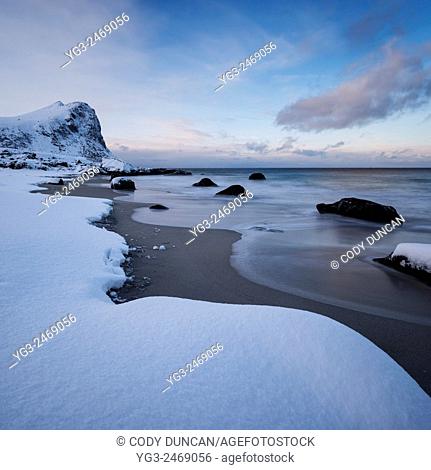 Snow covered Myrland beach in winter, Flakstadøy, Lofoten Islands, Norway