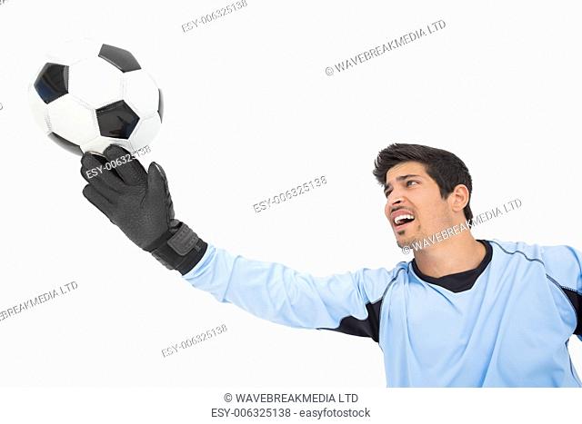 View of goal keeper in action over white background