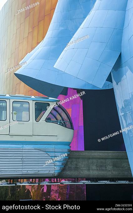 The monorail stopping at the station at the Museum of Pop Culture (designed by Frank O. Gehry) at the Seattle Center in Seattle, Washington State, USA