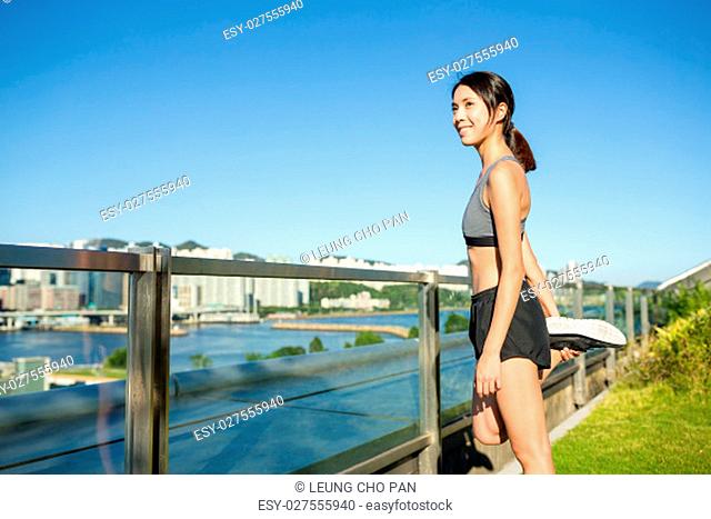 Woman stretching legs at outdoor