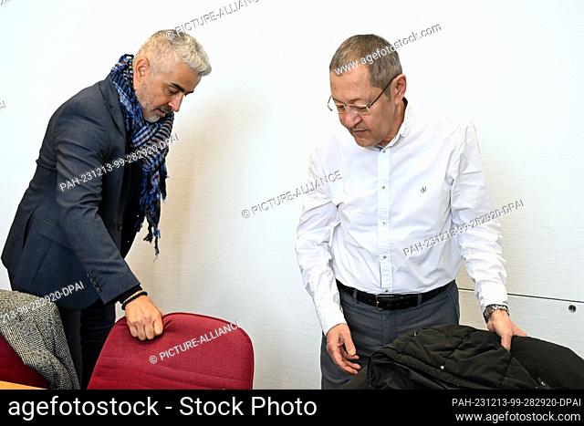 13 December 2023, North Rhine-Westphalia, Bonn: Author and blogger Akif Pirincci (r) and his lawyer Mustafa Kaplan wait in the courtroom of the district court...