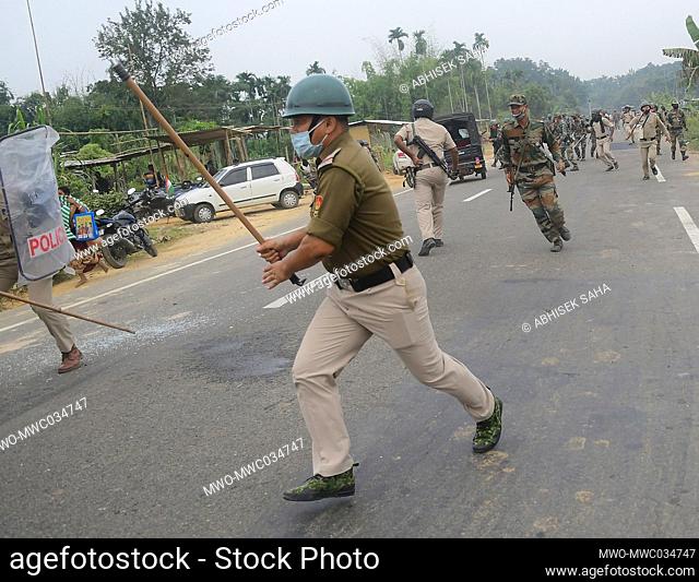 Protesters getting involved in a clash with police on the National highway 8, at Panisagar. Violent confrontations broke out between the anti-Bru resettlement...