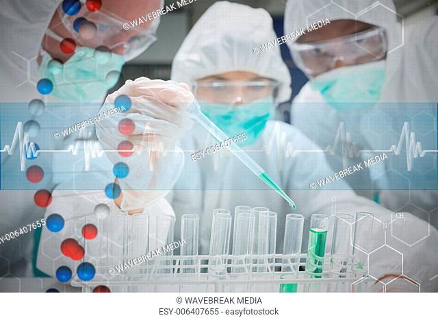 Composite image of chemist adding green liquid to test tubes as two others are watching