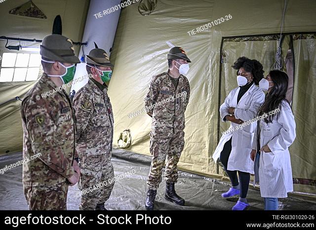 The Alpini of the Taurinense Brigade install field tents for the pre-treatment and first aid in the hospital of Rivoli , Turin, ITALY-30-10-2020