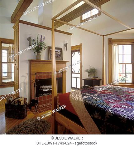 BEDROOMS - Small roof top cottage, shaker style interior, four poster bed, quilt, fireplace with brick hearth, antique mantel