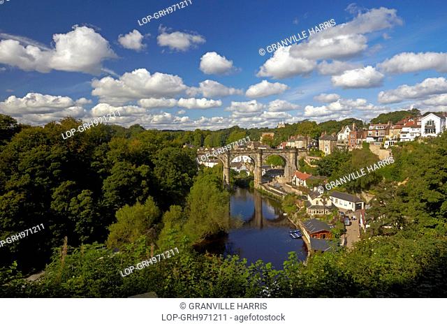 A view of Knaresborough and the River Nidd showing the Victorian railway viaduct reflected in the waters below