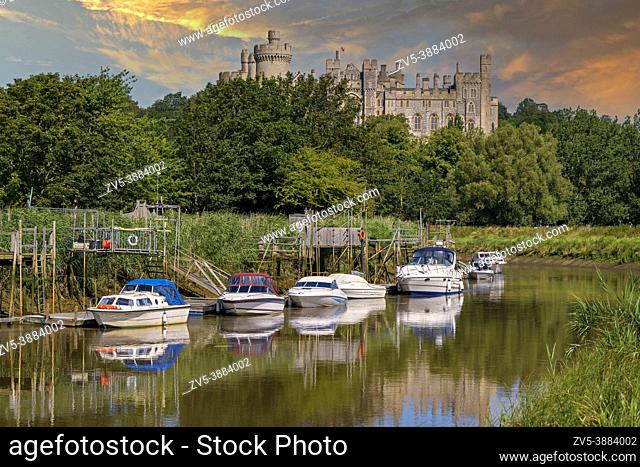 Arundel Castle and boats on the River Arun during sunset, Arundel, West Sussex, England, Uk