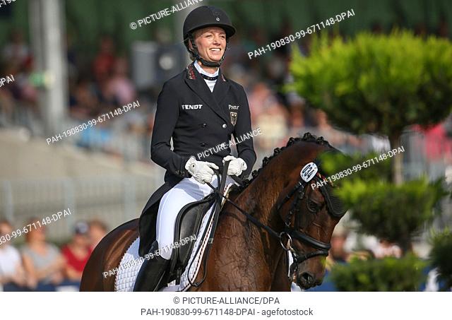 30 August 2019, Lower Saxony, Luhmühlen: Equestrian sport, eventing, European Championships: German event rider Anna Siemer on FRH Butt's Avondale is looking...