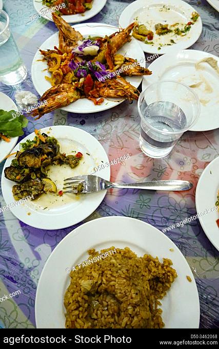 Marsa Matruh, Egypt An assortment of dishes at a local fish restaurant including grilled shrimp, rice, eggplant, salads