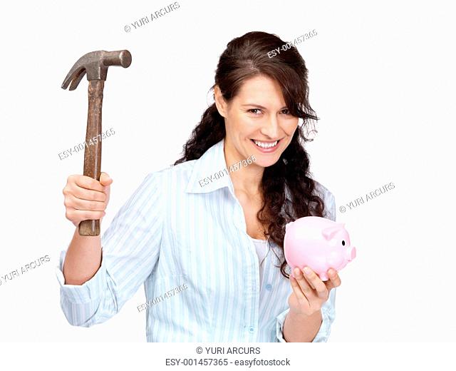 Portrait of an attractive young woman about to break a piggybank over white background