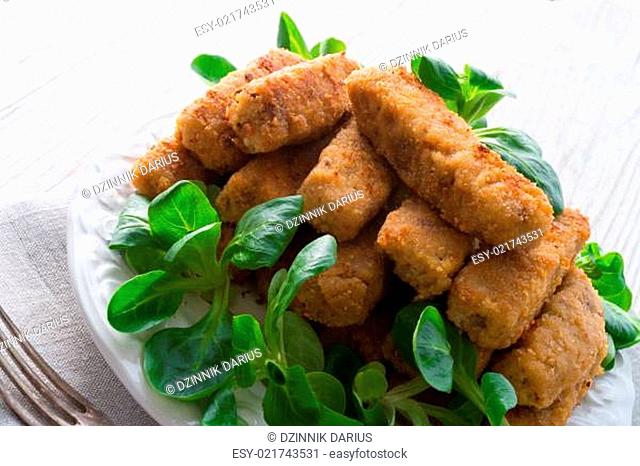 home-baked fish sticks with salad