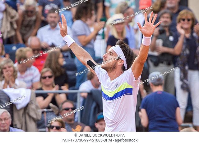 Leonardo Mayer of Argentina celebrates his victory over Mayer of Germany in the men's singles final of the Tennis ATP-Tour German Open in Hamburg, Germany
