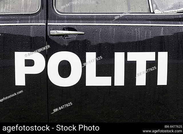 White inscription Politi, police on black patrol car VW Beetle, classic car from 1965, raindrops, Bodø, Bodo, Nordland, Norway, Europe