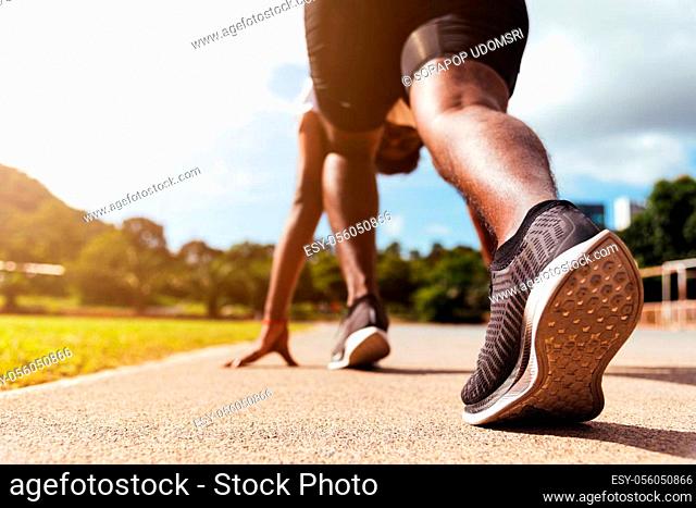 Asian young athlete sport runner black man active ready to start running training at the outdoor on the treadmill for a step forward, healthy exercise workout