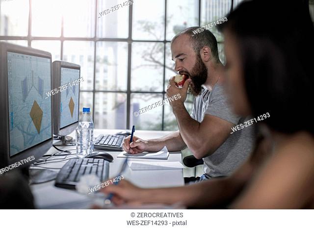 Adult Education, student eating an apple at computer training centre