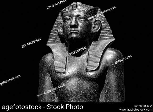 Pharaoh Egyptian gods dead religion symbol stone statue isolated on black. Stone pharaoh tutankhamen mask on black background