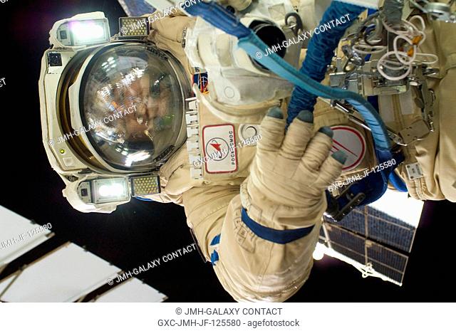 Russian cosmonaut Oleg Skripochka, Expedition 26 flight engineer, wearing a Russian Orlan-MK spacesuit, participates in a session of extravehicular activity...