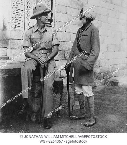 INDIA -- circa 1930 -- Captain James W Snyder - an Army intelligence officer, who was an historian in civilian life, with a veteran guide somewhere in India