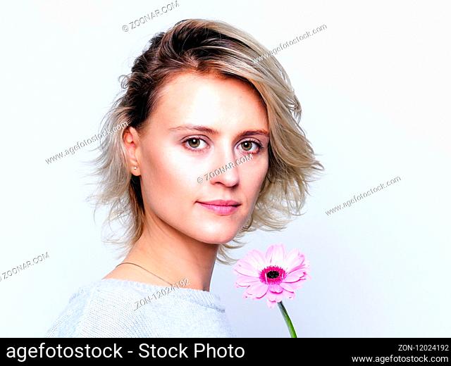 Romantic woman with pink flower