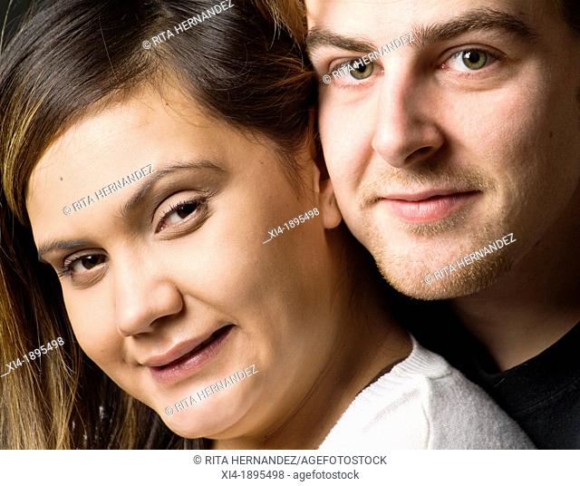 First nations female and caucasian male close-up portrait Engaged couple