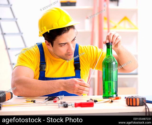 The drunk engineer working in the workshop