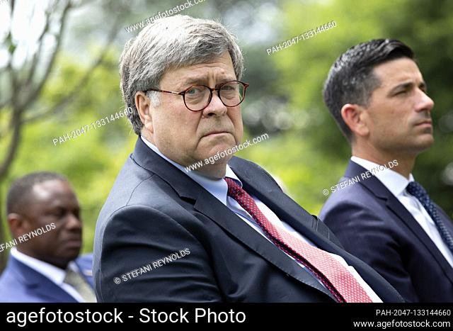 United States Attorney General William P. Barr listens as United States President Donald J. Trump speaks prior to signing an Executive Order on Safe Policing...
