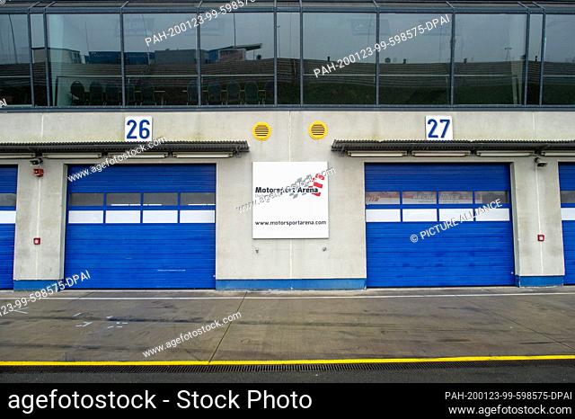 22 January 2020, Saxony-Anhalt, Oschersleben: ""Motorsport Arena Oschersleben"" is written on a sign in the pit lane of the race track