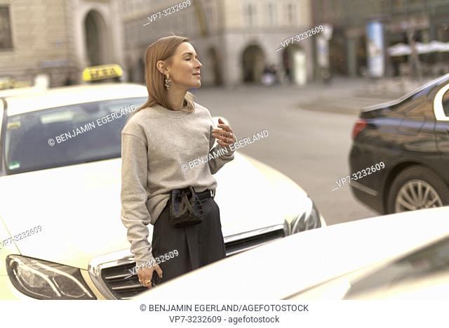 stylish blogger woman at street, streetstyle, in city Munich, Bavaria, Germany