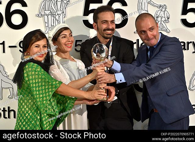 Film director Sadaf Foroughi, 2nd from left, poses with Crystal Globe Grand Award in main competition for film Summer with Hope within the 56th International...