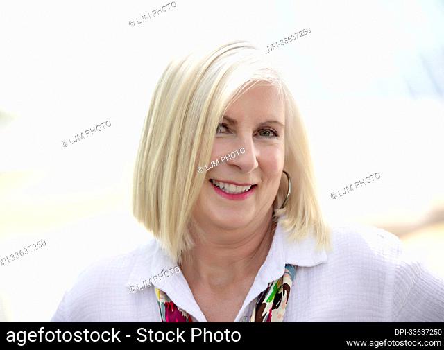 Close-up portrait of a mature woman with white hair; Edmonton, Alberta, Canada