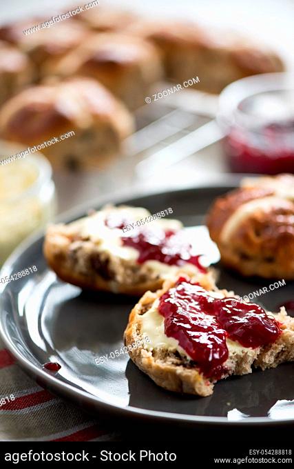 Serving fresh homemade scones with cream and jam