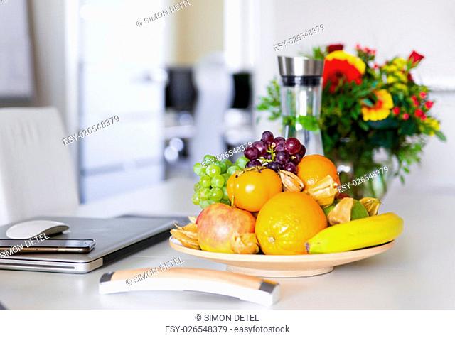 fresh fruits on a white office table