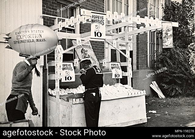 Booth selling Popeye whistles at Eastern States Fair. Springfield, Massachusetts. United States. Farm Security Administration (Sponsor) Mydans