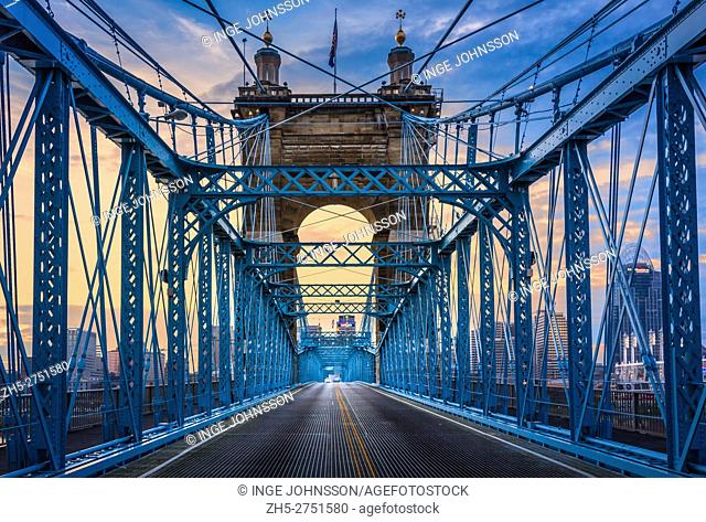 The John A. Roebling Suspension Bridge spans the Ohio River between Cincinnati, Ohio and Covington, Kentucky. When the first pedestrians crossed on December 1