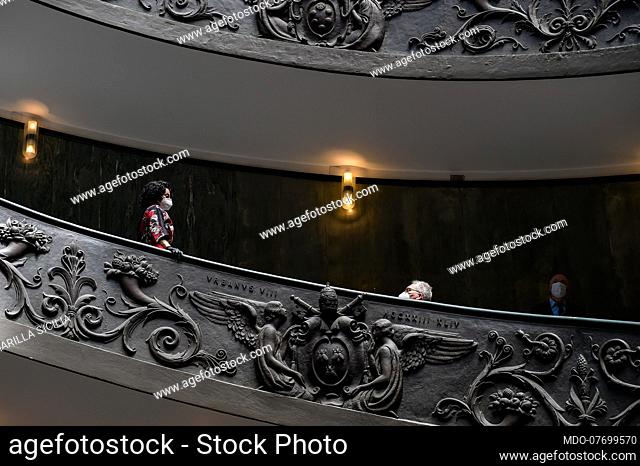Reopening of the Vatican Museums in phase two after the lock-down due to the Coronavirus emergency (Covid-19). Tourists with protective masks go down a...