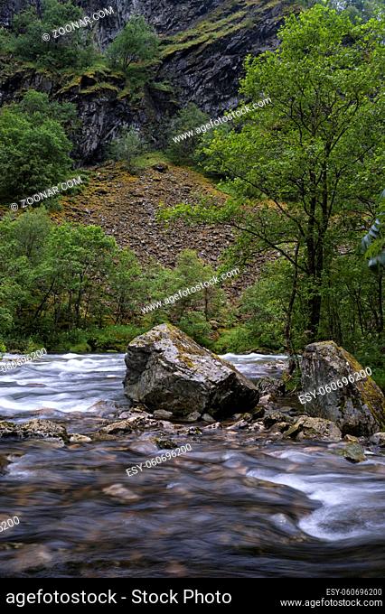 Large rock in the Stalheimselvi river near the Norwegian village Stalheim the municipality Voss in Hordaland county