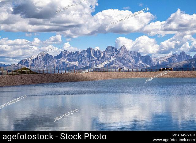 Italia, Trentino, province of Trento, Predazzo, Fiemme valley. Artificial lake, a water reserve for the snow-making of the ski slopes