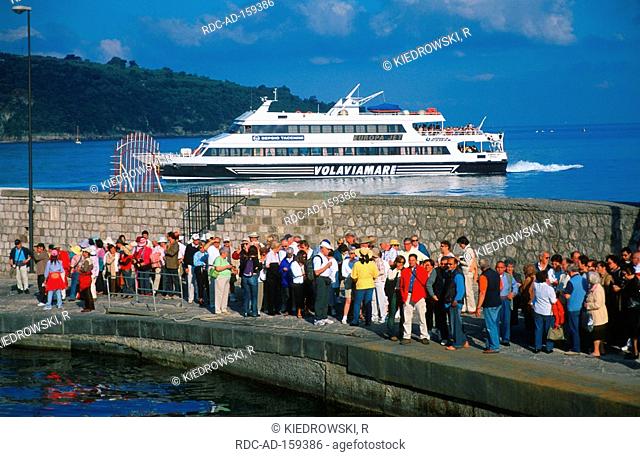 Tourists waiting for ferry  'Volaviamare' Sorrento peninsula Sorrento Bay of Naples Campania Italy