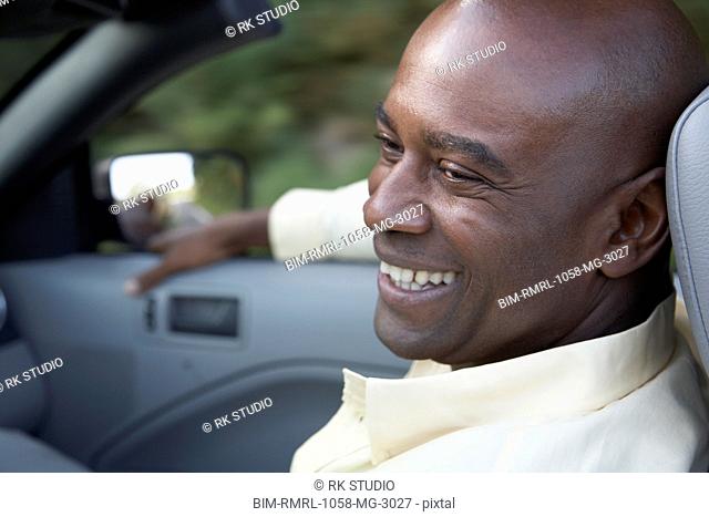Portrait of African man in convertible car