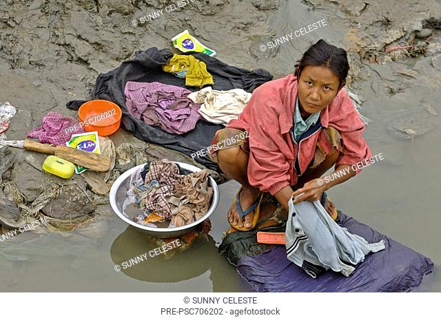 Washing clothes in Irrawaddy river, Myanmar