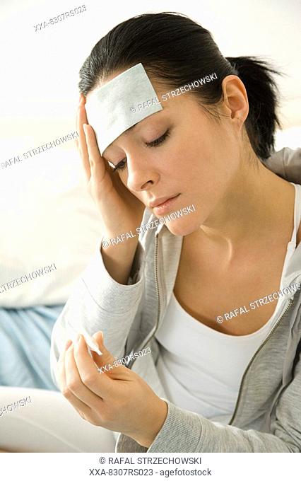 Woman taking temperature