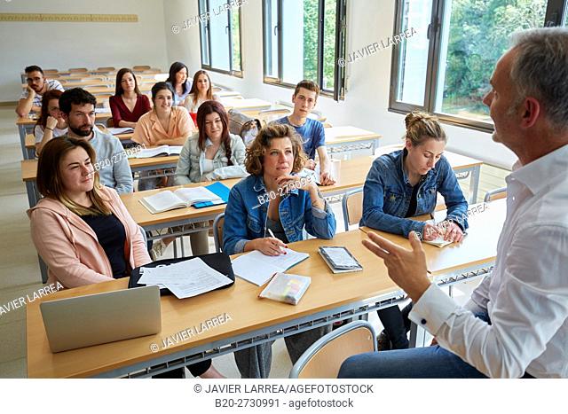 Professor with students at business school