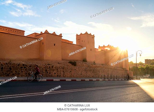 Morocco, High Atlas, Ouarzazate, Kasbah Taourirt, Cyclist, Sunbeams, Kasbah Taourirt